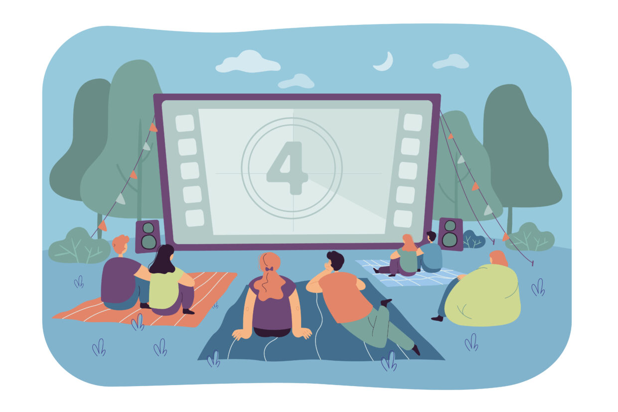 Friends watching movie in open air cinema